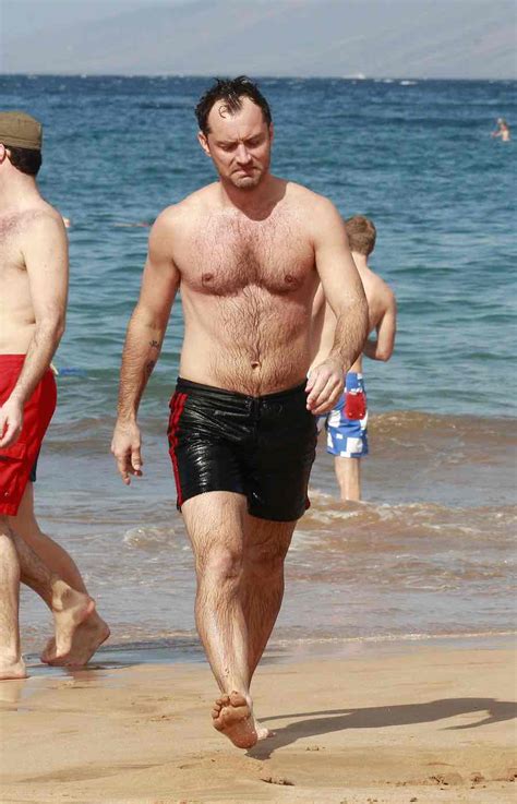 jude law   dip   ocean  riding  waves