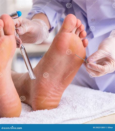 Podiatrist Treating Feet during Procedure Stock Image - Image of