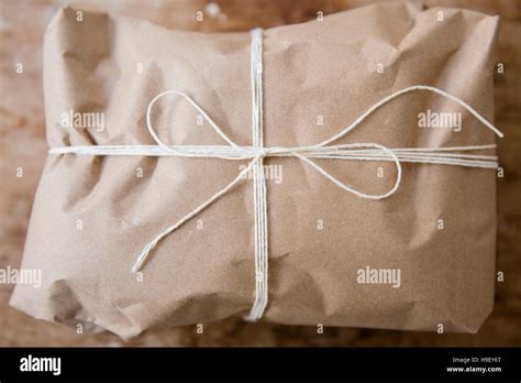string tied  package wrapped  brown paper stock photo alamy