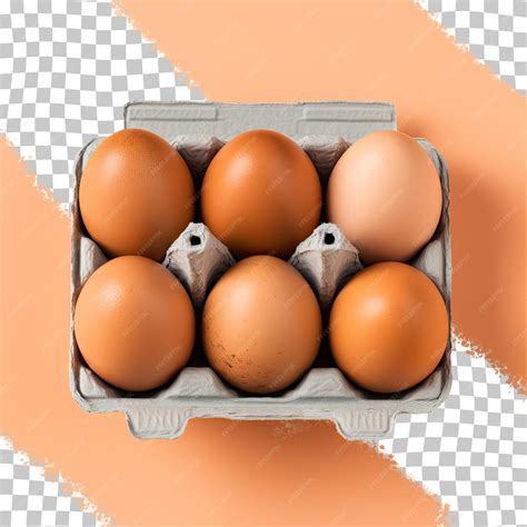Шесть коричневых куриных яиц в коробке, разделенных на прозрачном фоне ...