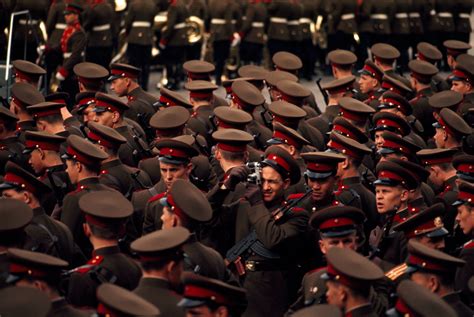 A Soviet soldier surrounded by colleagues photographs May Day parades ...