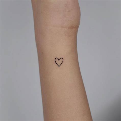 Minimalist heart tattoo on the wrist