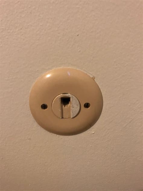 An old phone jack at my house looks like Jake the Dog : r/mildlyinteresting