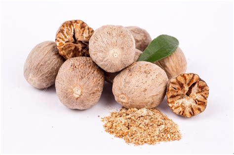 premium photo nutmeg spice isolated   white background