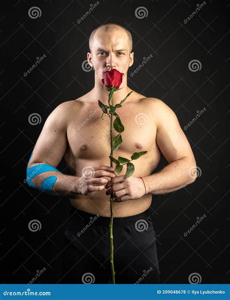 Athletic Man Holding a Red Rose, Naked for the Day of Velentin Pumped