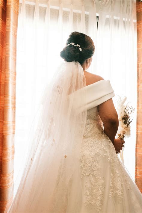 Woman Wearing White Lace Wedding Gown Standing Near the Cliff · Free