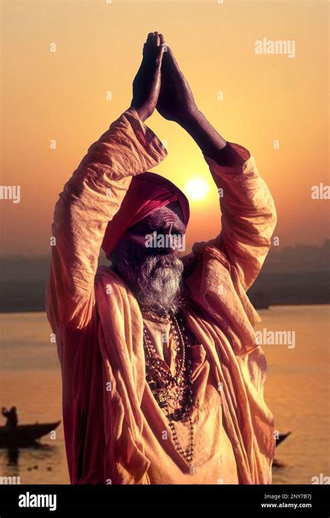 sadhu worshipping river ganga ganges  varanasi uttar pradesh