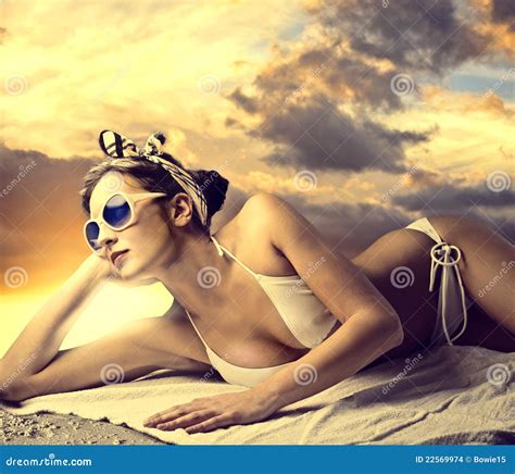 Sunbathing stock photo. Image of skin, summer, towel - 22569974