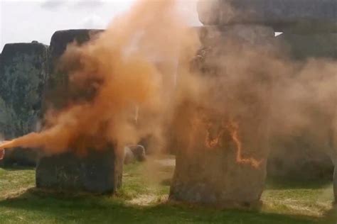 people charged  orange paint  thrown  stonehenge