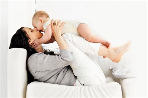Download Mother Kissing Baby Love Wallpaper | Wallpapers.com