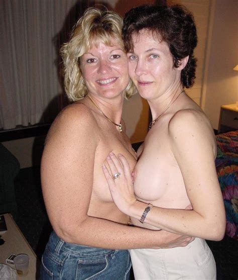 Mature lesbians touching each other's boobs