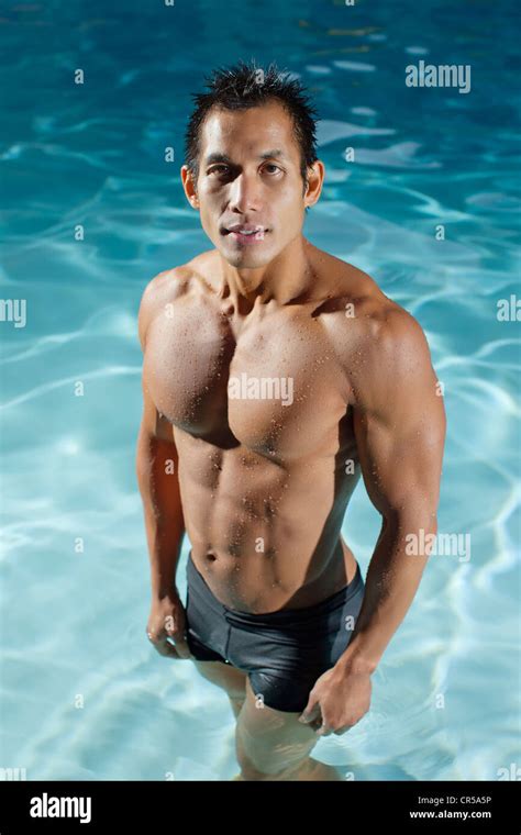 Pacific Islander man standing in swimming pool Stock Photo - Alamy