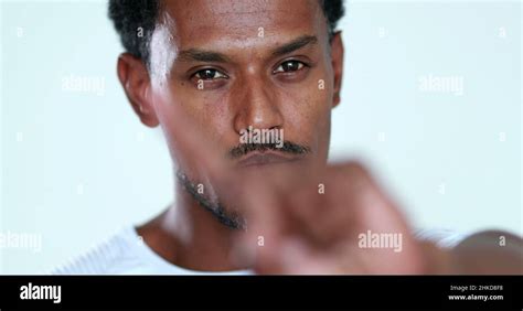 upset african man shaking finger rejecting offer man disapproving