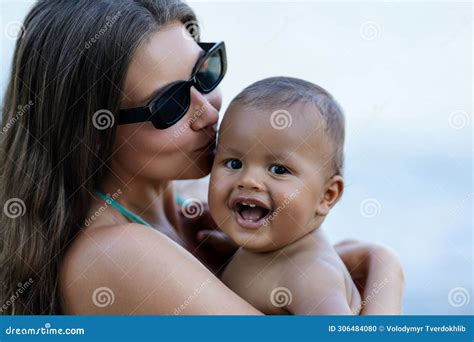 Close Up Portrait of Mother Kissing Multiracial Baby. Mom Kiss Biracial ...