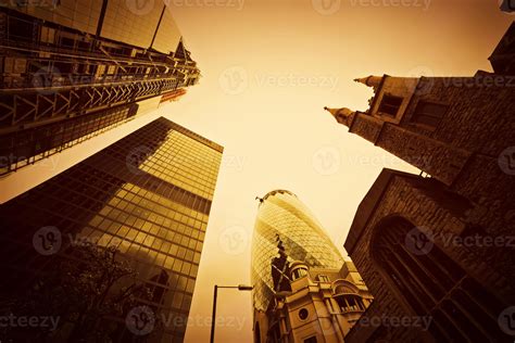 Business architecture, skyscrapers in London, the UK. Golden tint