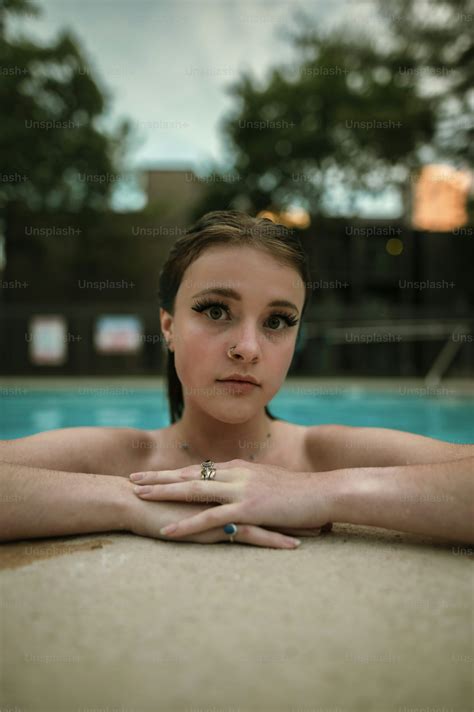 woman   bikini standing   swimming pool photo woman image