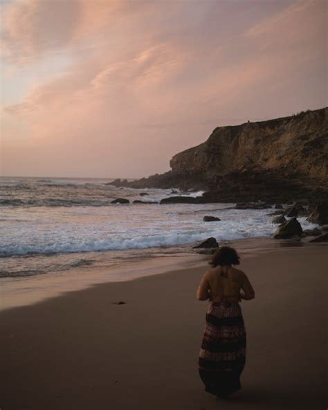 A Woman Wearing Dress on a Beach · Free Stock Photo