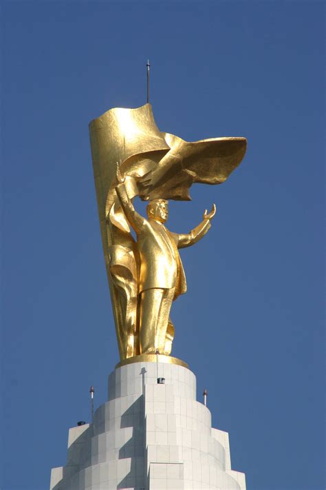 Gracefully rotating golden statue of Turkmenistans former El Presidente ...