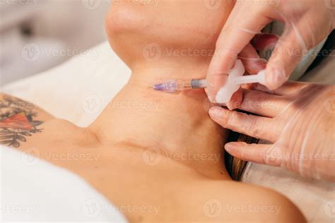Injections of the neck. Injection of beauty. 69097257 Stock Photo at