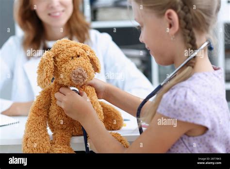 Little child with stethoscope at doctor reception Stock Photo - Alamy