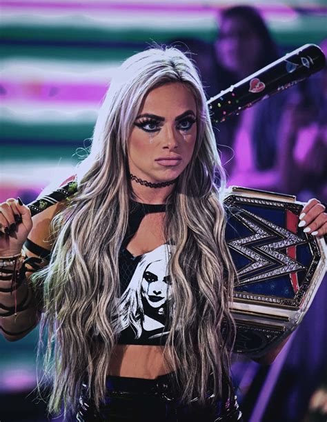 Download Liv Morgan Holding Wwe Belt Black Bat Wallpaper | Wallpapers.com