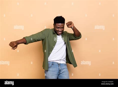Photo of excited guy dance night club dynamic motion wear denim jeans ...