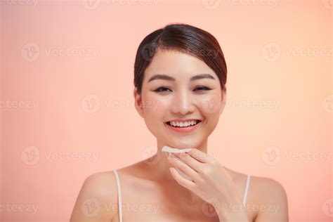 Closeup Portrait Of Beautiful Healthy Girl With Nude Makeup Cleaning