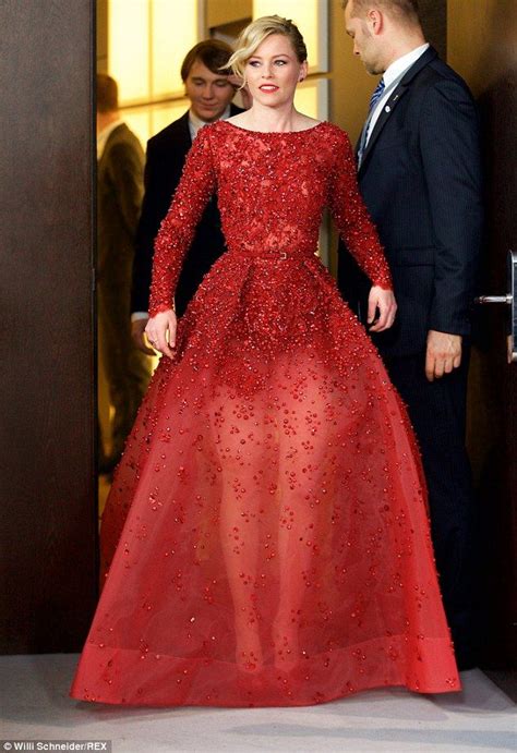 Elizabeth Banks steals the show in a sweeping scarlet semi-sheer gown ...