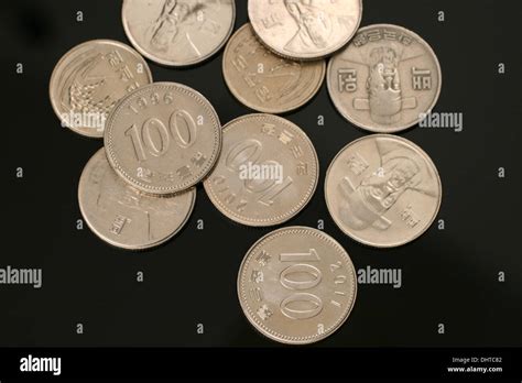 South Korean Won Coins On A Black Background Stock Photo - Alamy