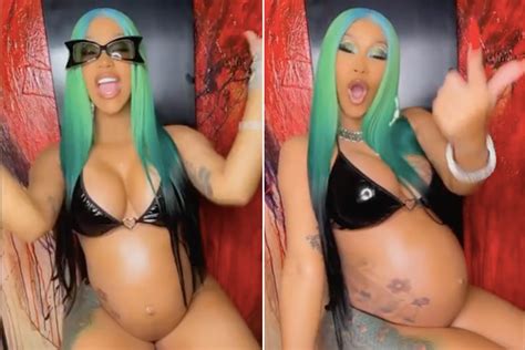 Bikini-clad Cardi B drapes her baby bump in gold chains