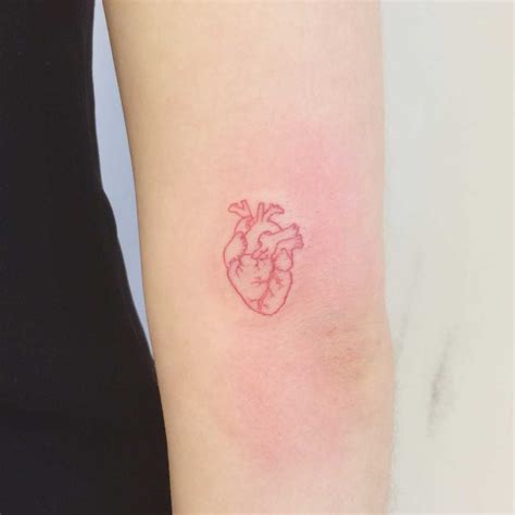 A tiny red heart tattoo by Annelie Fransson - Tattoogrid.net