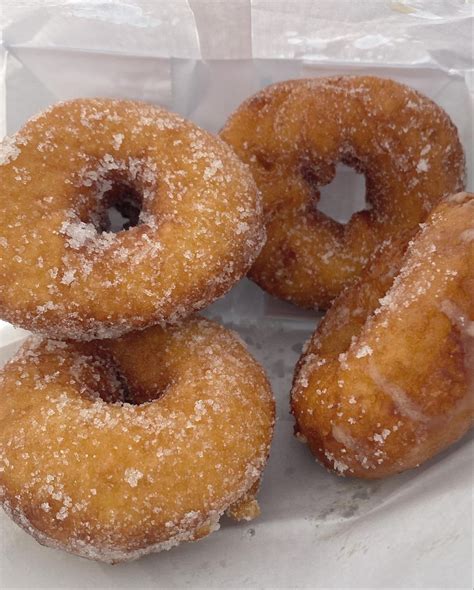 delicious sugared donuts   white bag