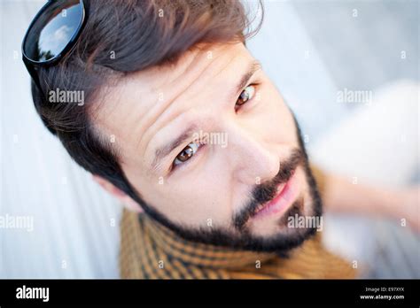 Portrait of young man with beard and brown hair Stock Photo - Alamy