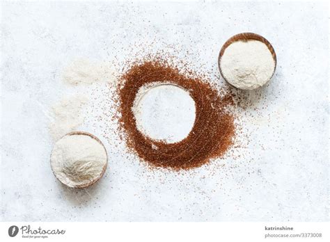 Teff flour in bowls and teff grain - a Royalty Free Stock Photo from Photocase