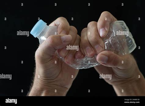 Hand crush plastic bottle hi-res stock photography and images - Alamy