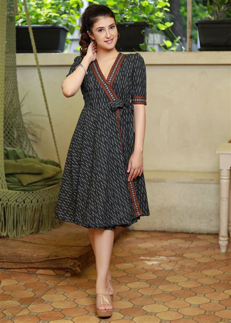 trendy black ikat overlap dress highlighted  matching ikat border
