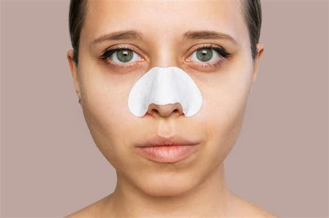 Premium Photo | Closeup of a woman with cleaning nose strips from ...