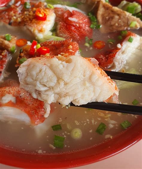 money amk hawker stall serves  red grouper fish head soup
