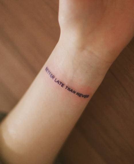 "Better late than never" tattoo on the wrist. By