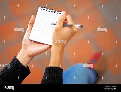 woman hand jot note stock photo alamy