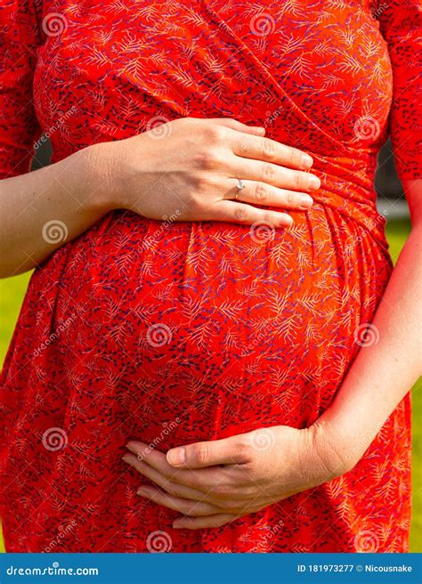 Pregnant Woman Caring and Sharing Love with Her Baby by Touching Her