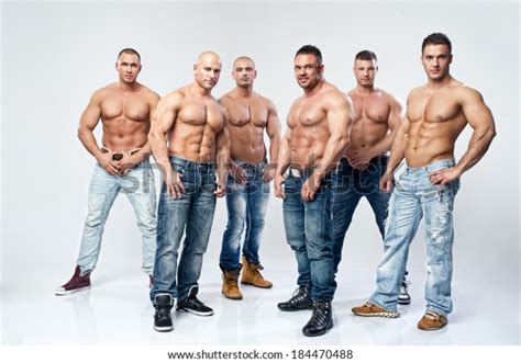 Group of six muscular young sexy wet naked handsome man posing