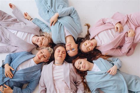 Company of women in suits in studio Stock Photo | Adobe Stock