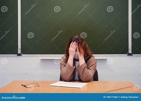 Sad Teacher Sits in a School Classroom, Copy Space Stock Photo - Image ...