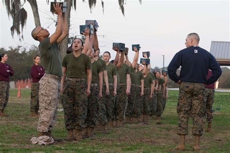 1st integrated company of men and women graduates from Marine Corps
