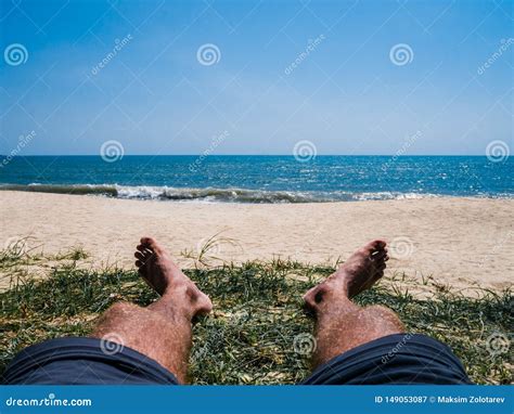 sunbathing man   sandy beach stock image image  blue resort