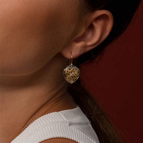 Harmony Heart pendant in 18K Gold and Sterling silver with rubies