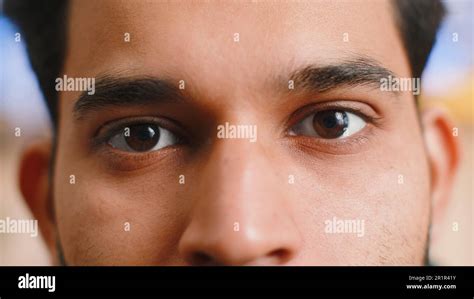 Extreme close-up macro portrait of smiling indian man face. Young guy ...