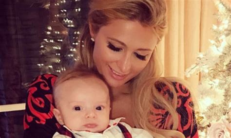 'Auntie Paris' Hilton cradles adorable baby at family Christmas dinner ...