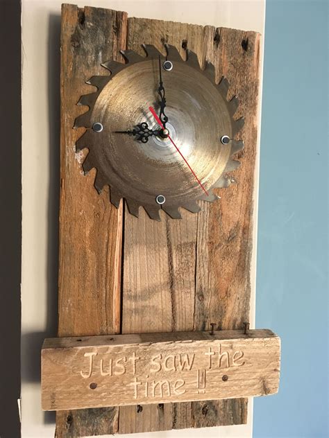 Circular saw blade as a pallet wood wall clock with the words ' Just ...